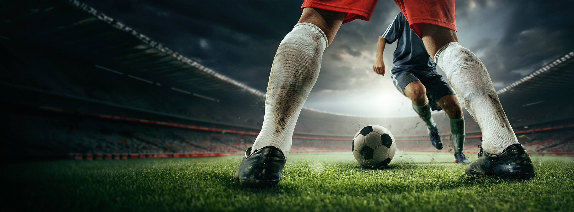 Cropped,Image,Of,Male,Legs,In,Dirty,Uniform,,Football,Players